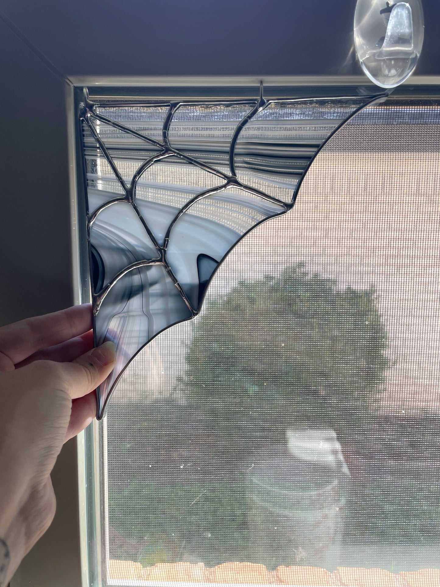 Silver and black spiderweb corner