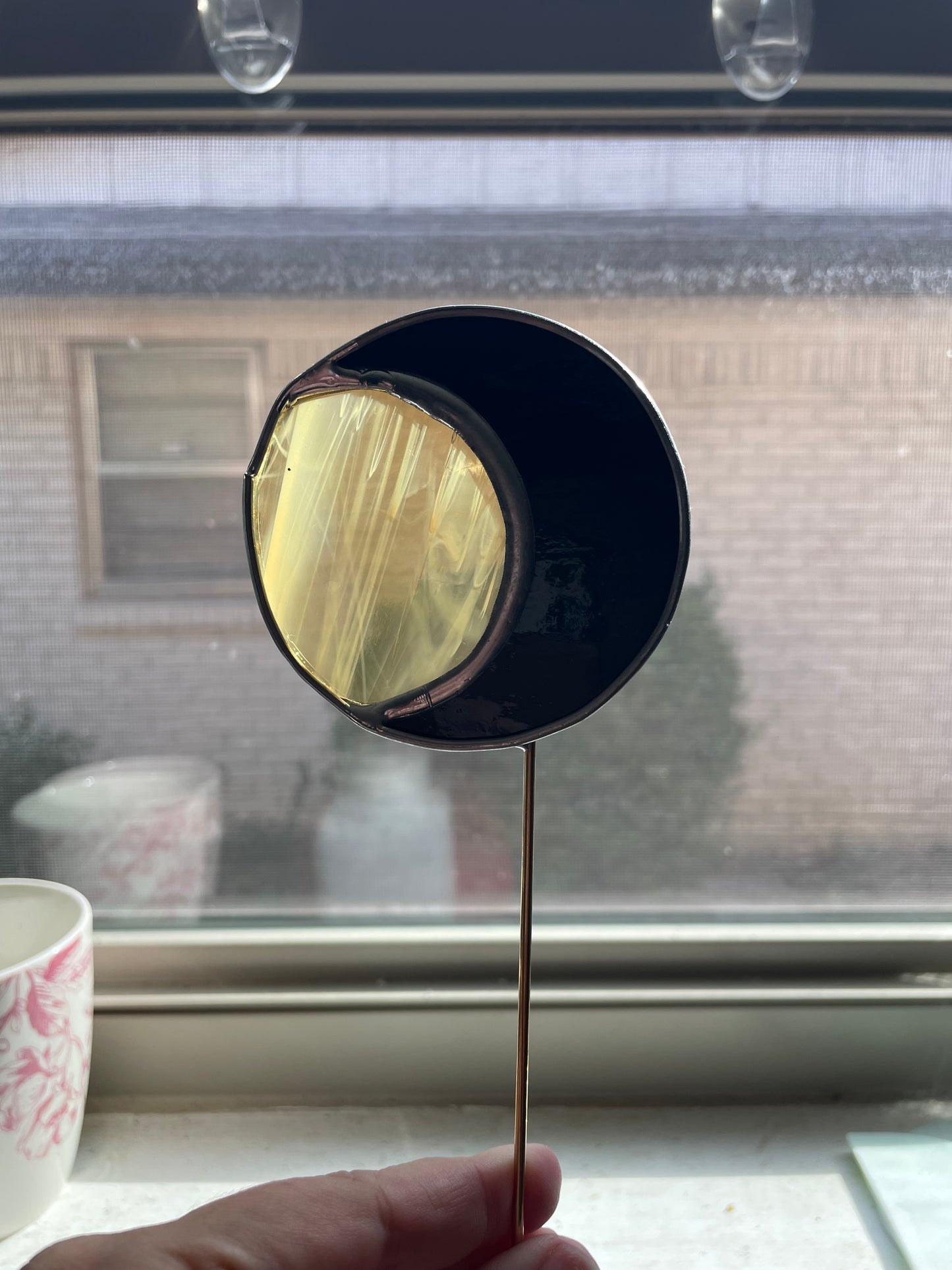 Black and orange moon plant stake