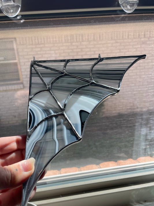 Silver and black spiderweb corner